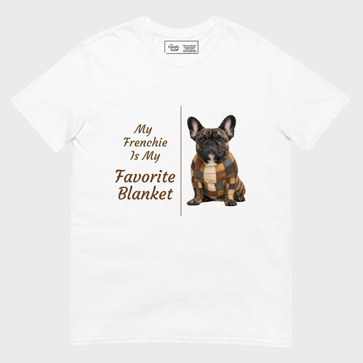 A white short-sleeve crewneck t-shirt featuring a graphic print of a French Bulldog wearing a brown and tan plaid blanket, next to the text 'My Frenchie Is My Favorite Blanket' in brown lettering.