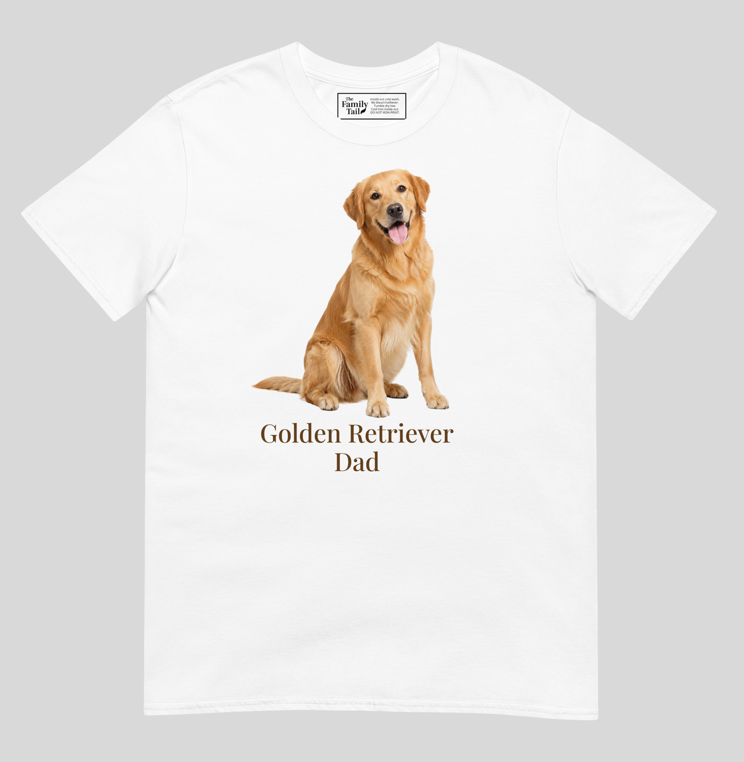 A white short-sleeve t-shirt with a graphic of a golden retriever dog sitting above the text 'Golden Retriever Dad' in dark brown font, shown on a light gray background.