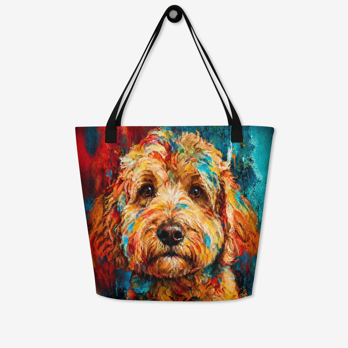 A tote bag with black shoulder straps, featuring a colorful, textured painting of a goldendoodle's face on the front, set against a plain light gray background.
