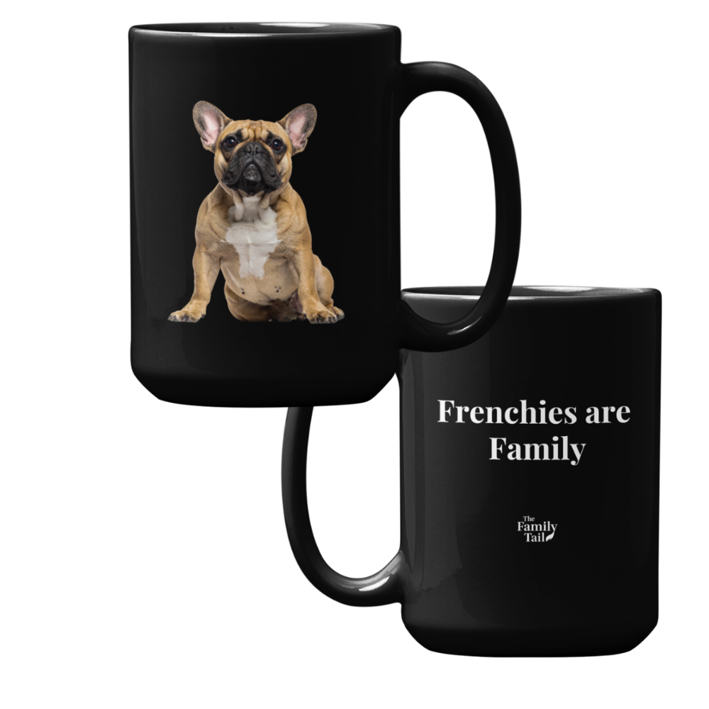 Two black ceramic mugs shown on a white background. The front-facing mug features a printed photo of a French bulldog, and the side-facing mug displays the white text 'Frenchies are Family' with a small 'The Family Tail' logo near the bottom.