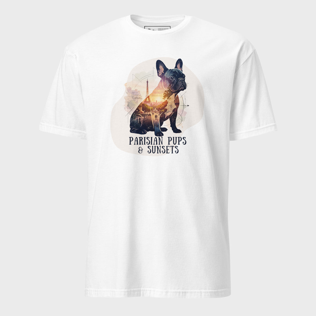 A white short-sleeve crewneck t-shirt featuring a graphic print of a French Bulldog with a sunset-filled silhouette and the text 'PARISIAN PUPS & SUNSETS' printed below it.