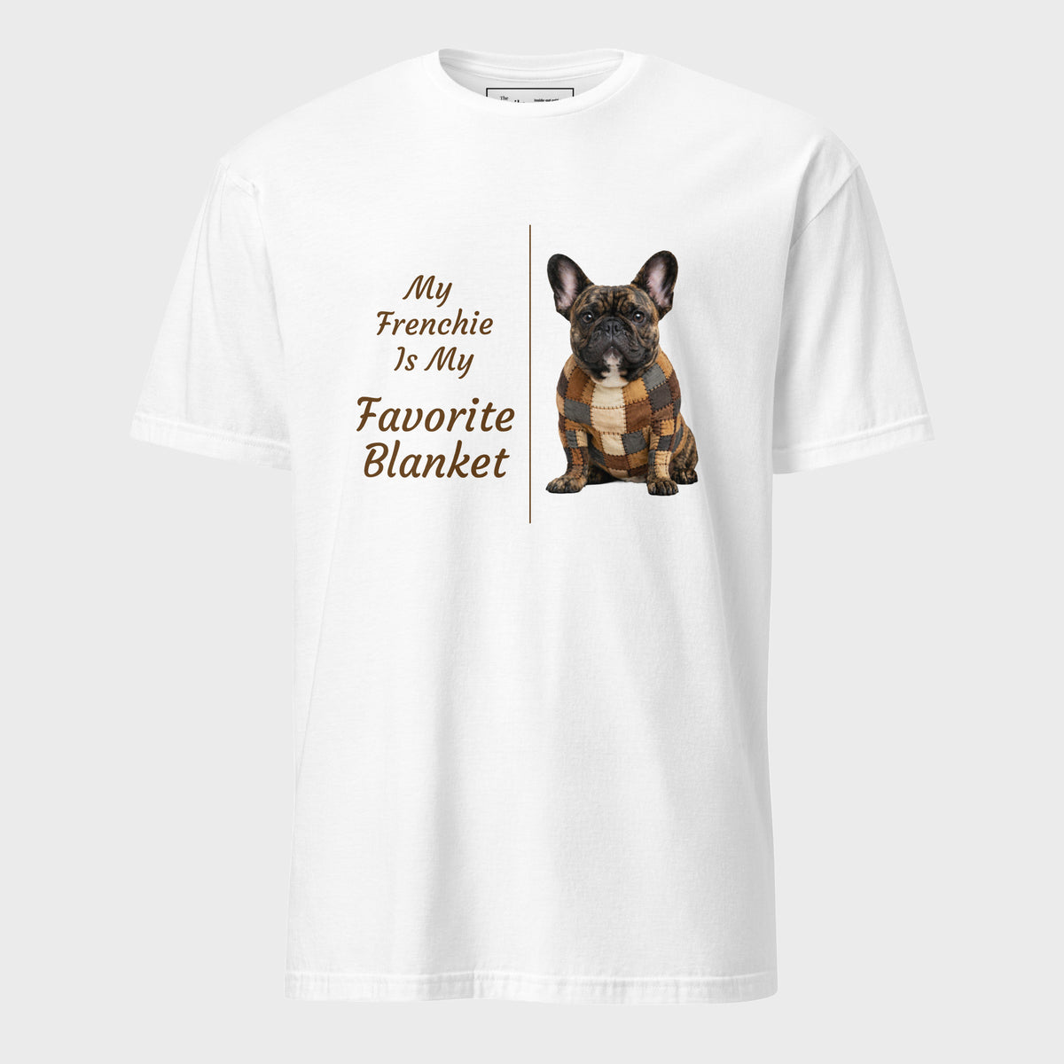 A white short-sleeve crewneck t-shirt featuring a graphic print of a French Bulldog wearing a brown and tan plaid blanket next to the text 'My Frenchie Is My Favorite Blanket' in brown lettering, displayed on a light gray background.