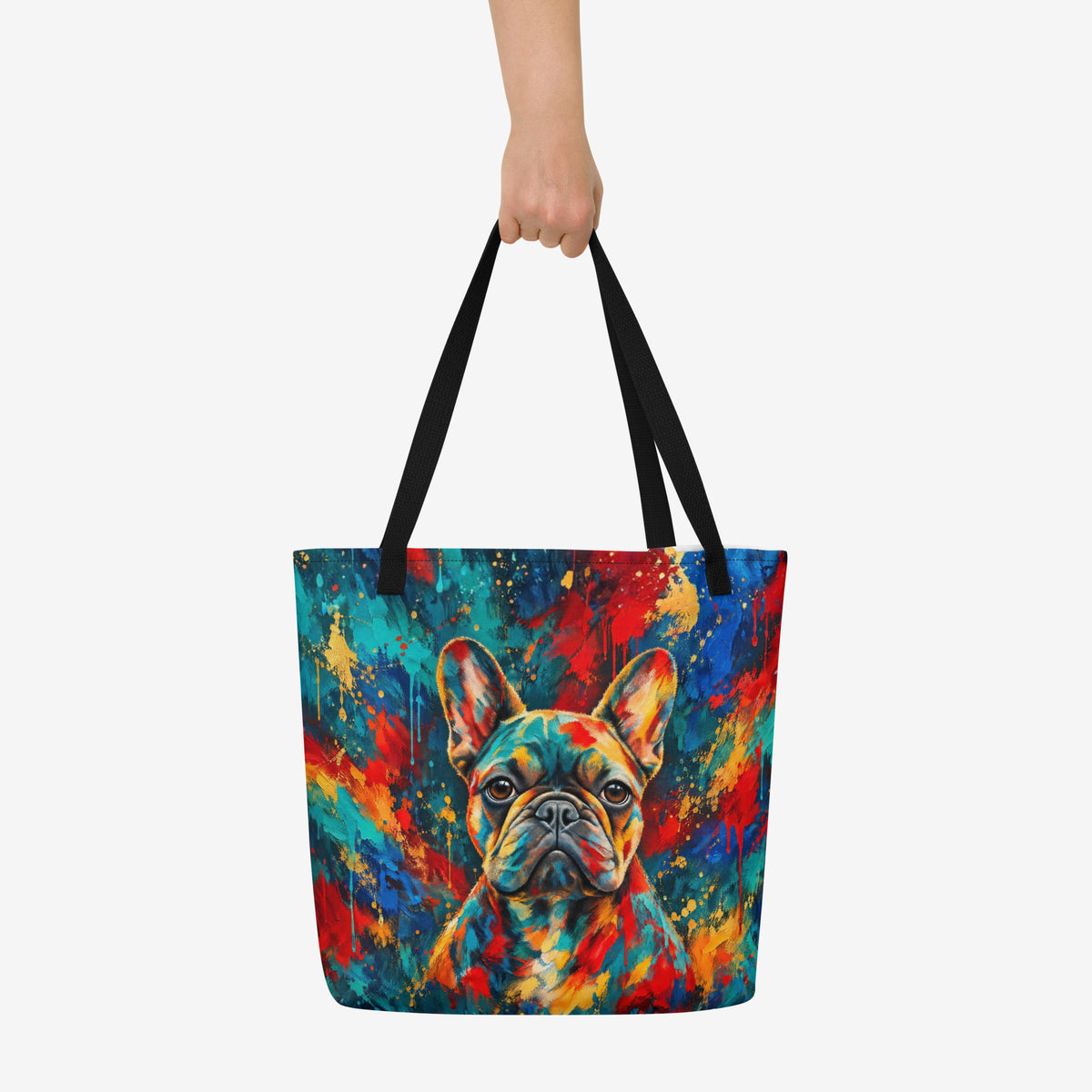 A tote bag with black shoulder straps, featuring a colorful abstract French Bulldog print on the front. The background of the print is a vibrant mix of blue, red, yellow, and orange paint splatters, with the dog's face rendered in blue, gray, and yellow tones.