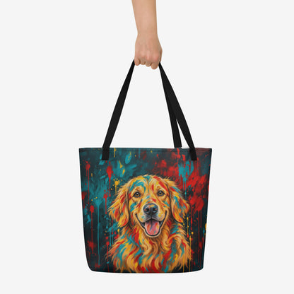 A tote bag with black handles featuring a colorful, textured painting of a golden retriever's face in warm orange, yellow, and red tones against a colorful background with teal, red, and yellow paint splashes.