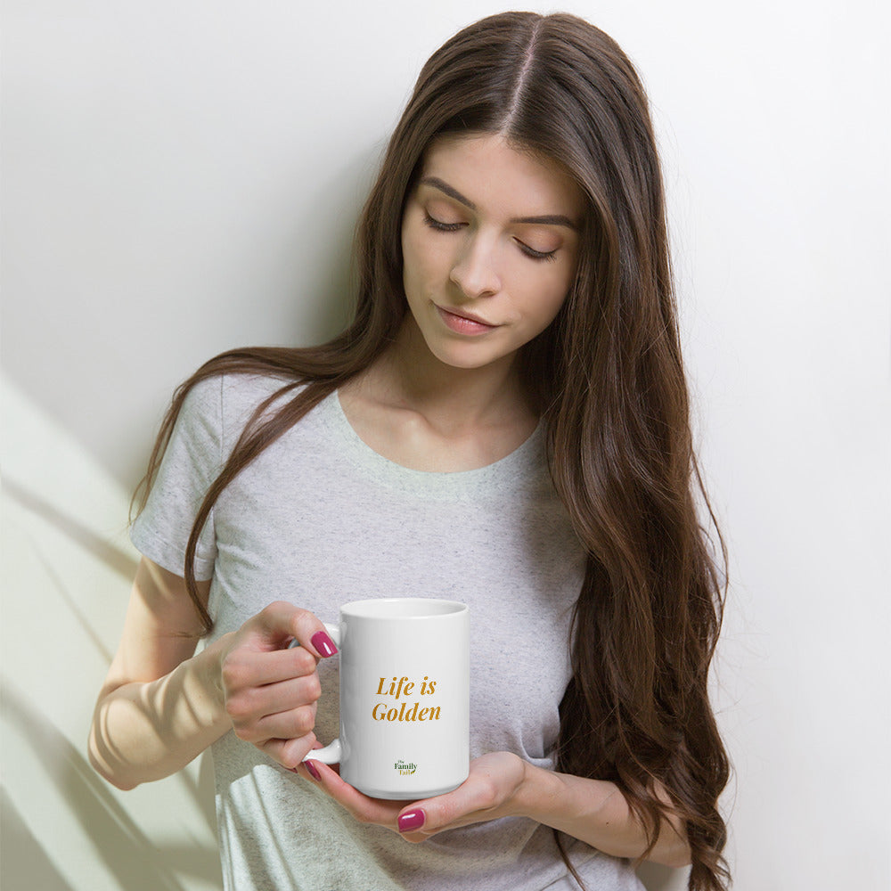 Woman holding white glossy ceramic mug with "Life is Golden" Golden Retriever design, 15 oz